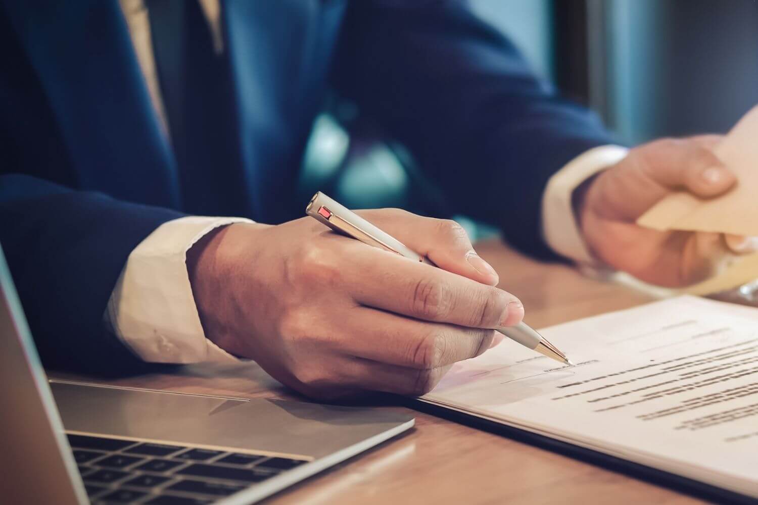 Man signing a contractor for insurance