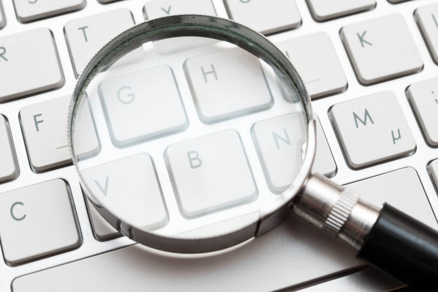 Magnifying glass on a computer keyboard