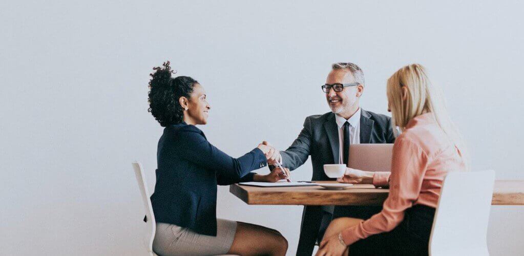 group-of-people-sat-down-at-a-meeting