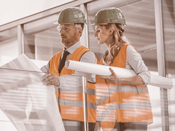 engineers-discussing-blueprints
