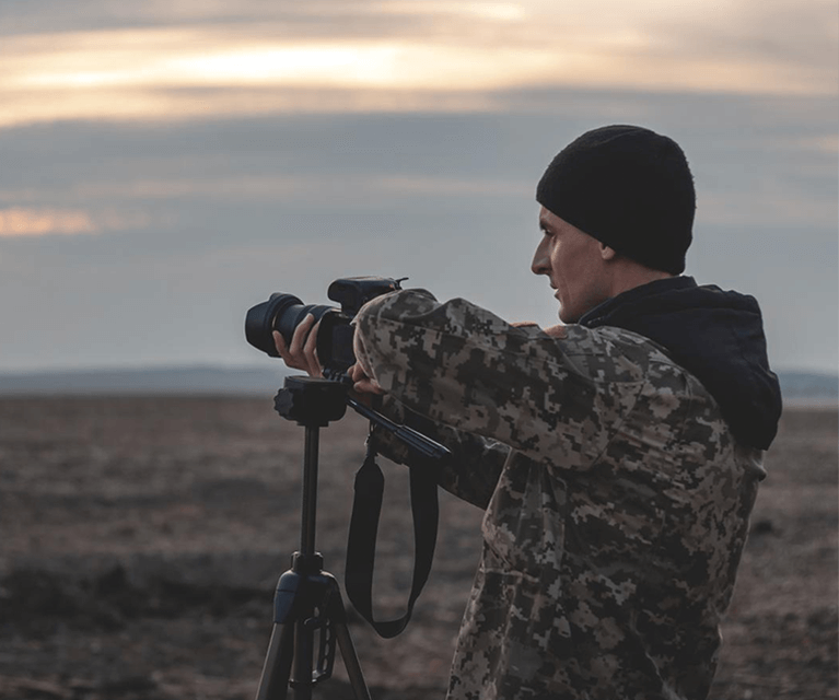 male-photographer-working-in-a-field