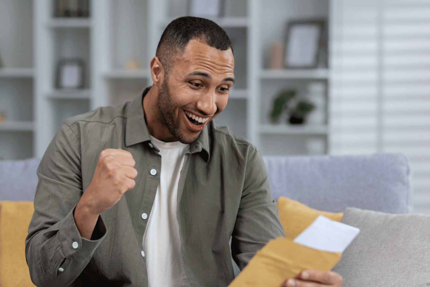 A tradesman celebrates getting a grant to give funding to his small business