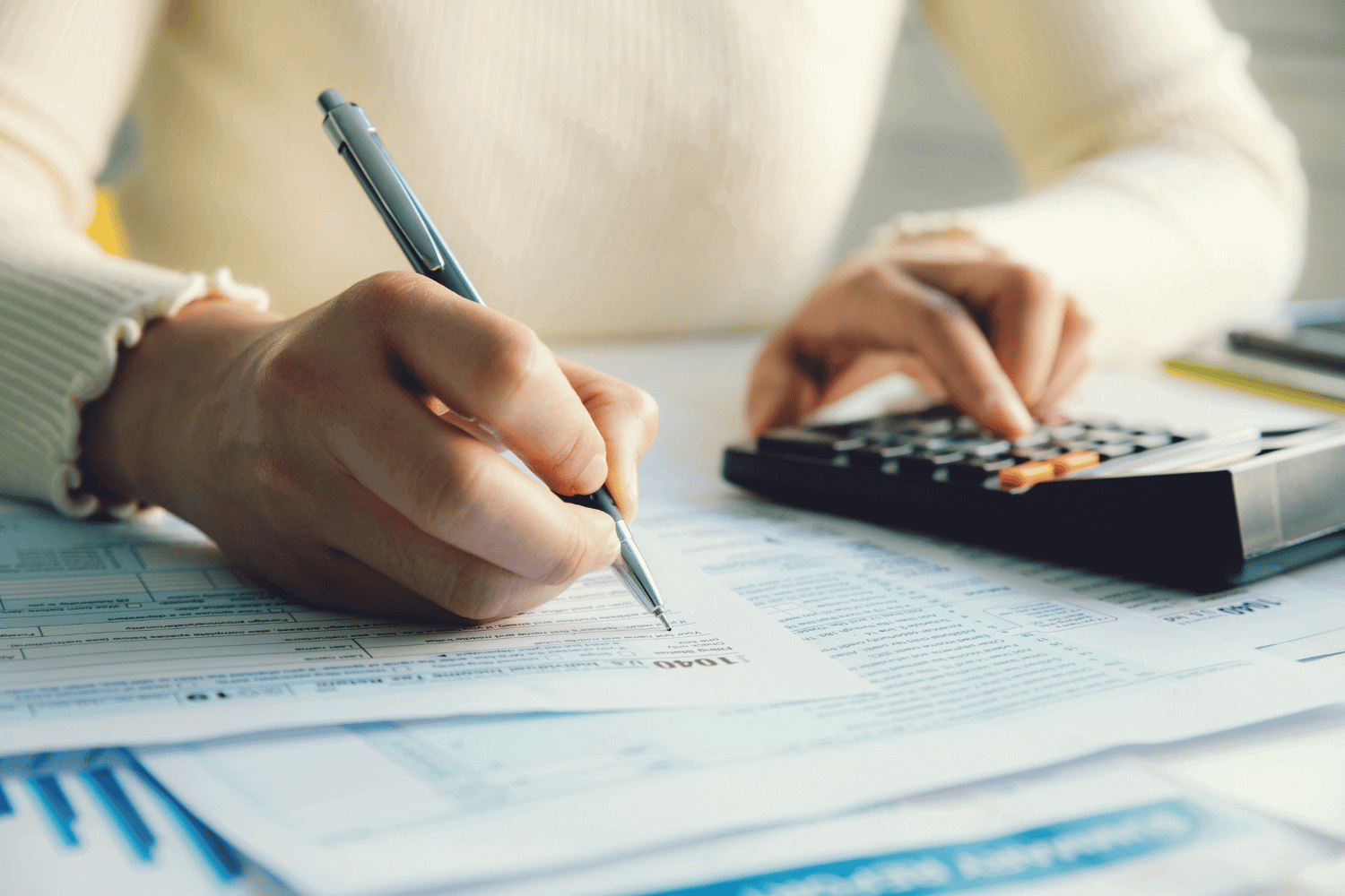 Picture of a female worker completing tax paperwork