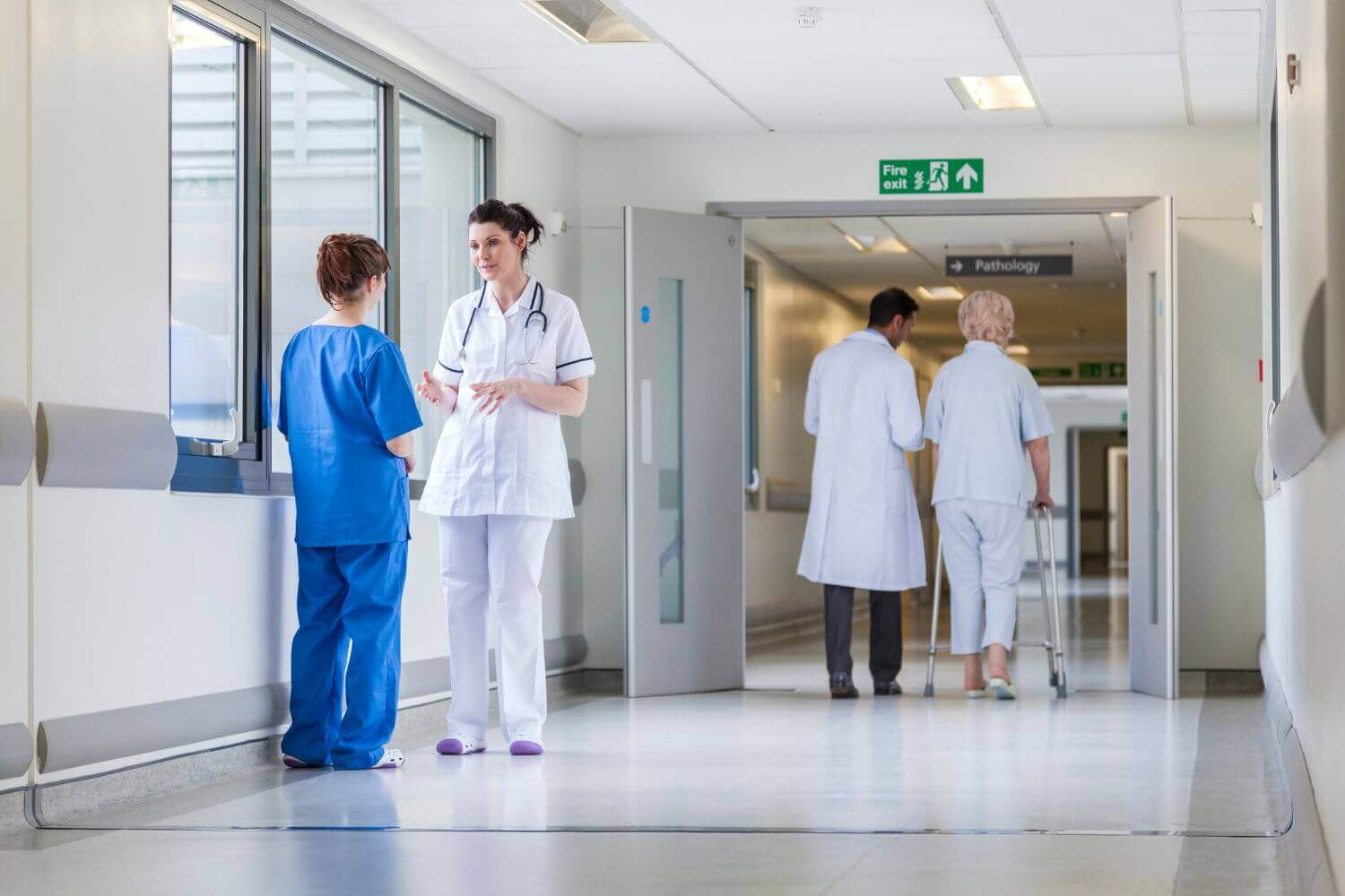 Healthcare workers in a hospital. Dr Iain Campbell discusses IR35 in the NHS and risks for contractors