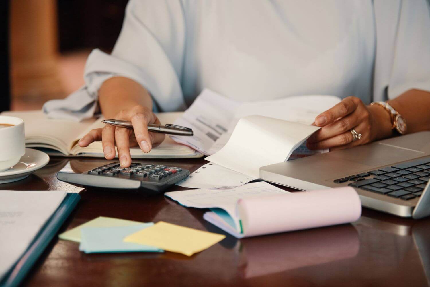 Image: self-employed managing tax. Article discussing decline in taxpayer usage of HMRC CEST tool