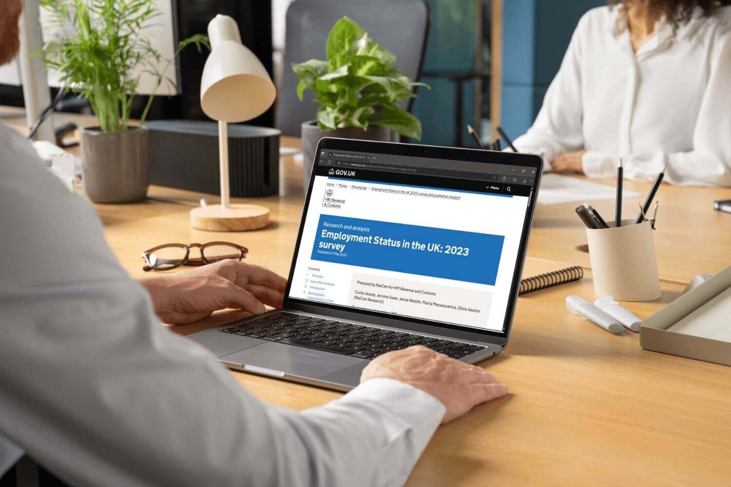 Laptop view of HMRC Employment status UK research. Experts critique 2023 worker status research