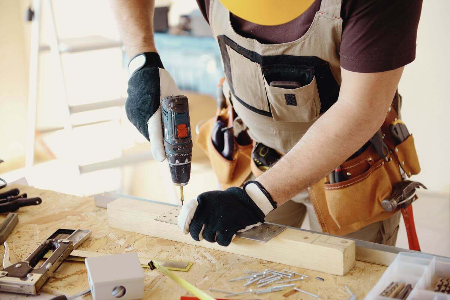 Tradesmen using power tools representing article discussing tool theft and answering 'is tool insurance worth it' for tradesmen
