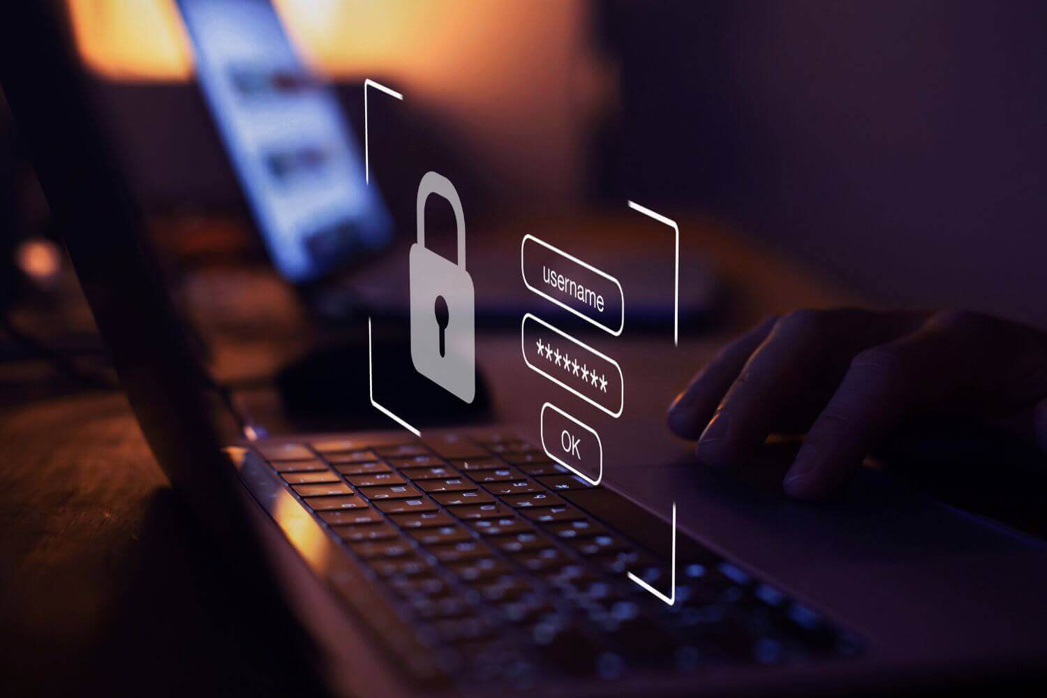Image of laptop keyboard with floating login screen graphic, representing article on key findings from 2025 cyber security reports