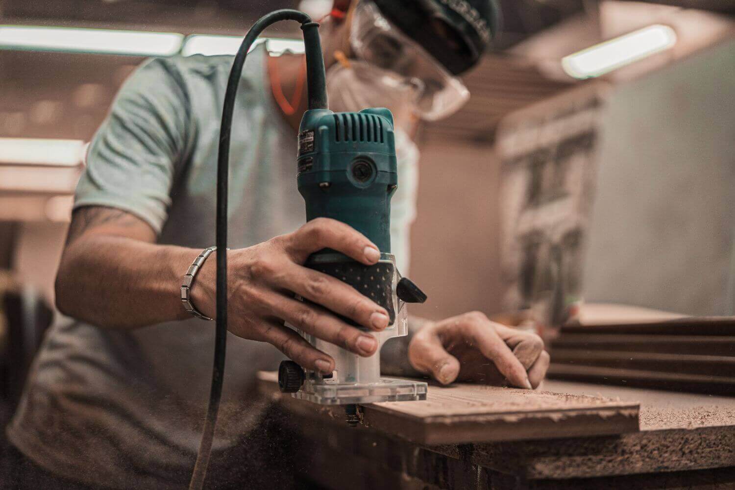 Image of tradesman using a power tool, representing article discussing how much is tool insurance and how to choose the right cover