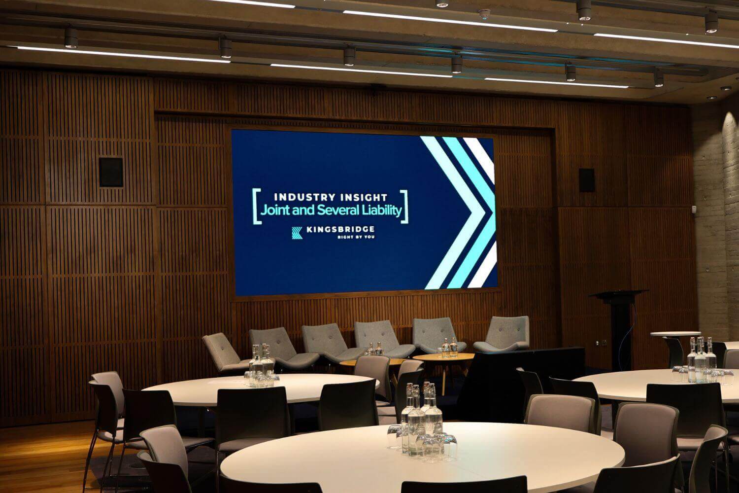 Photo of a presentation screen at an event held by Kingsbridge on the JSL legislation and what it means for recruitment agencies