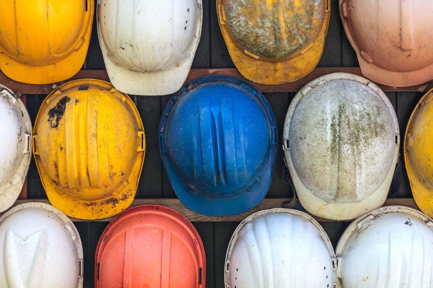 Image of construction hard hats representing a guide to what insurance a tradesman needs